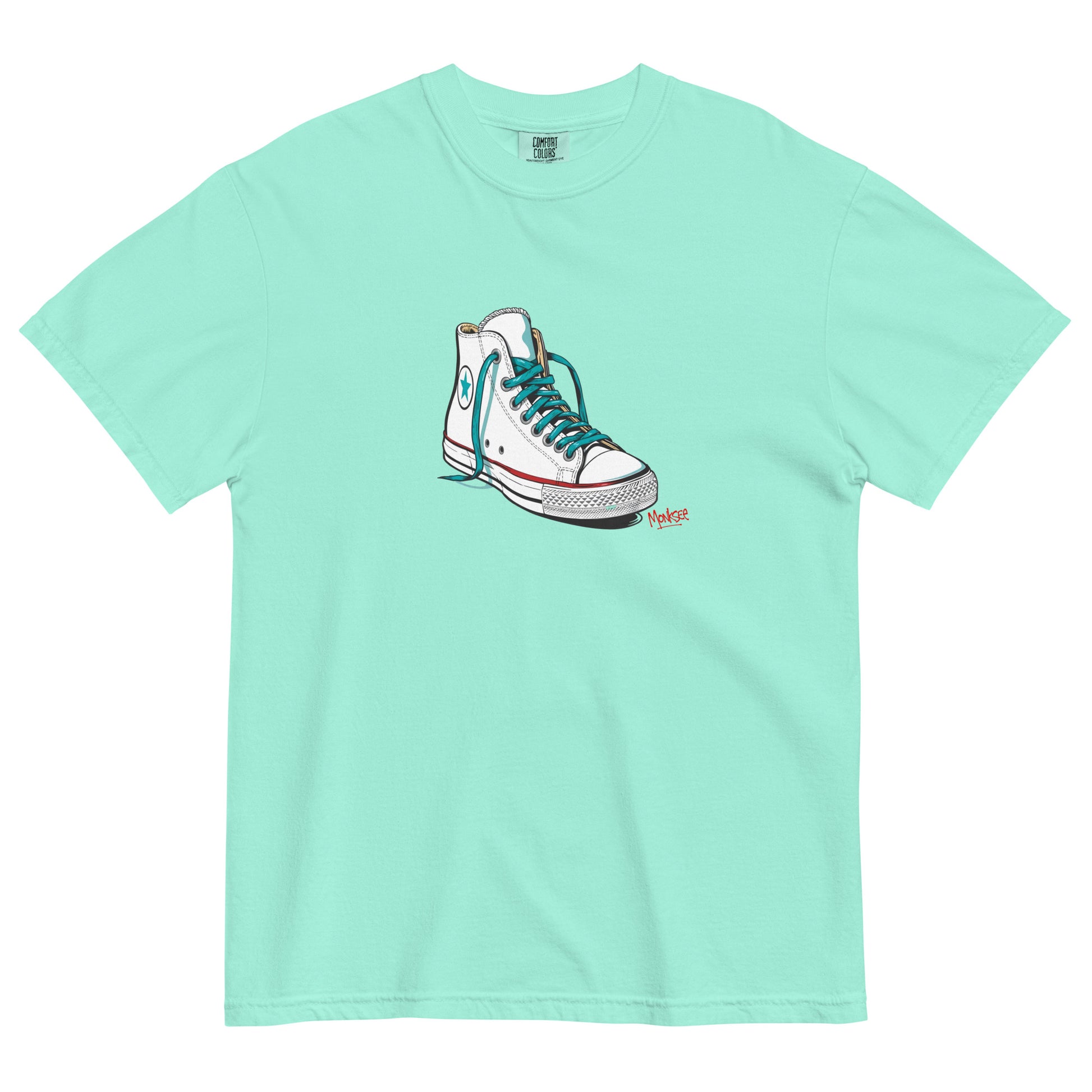 chalky mint garment dyed tshirt laying flat on white background. tshirt features design of a vintage chuck Taylor Allstars with monksee tag underneath in red
