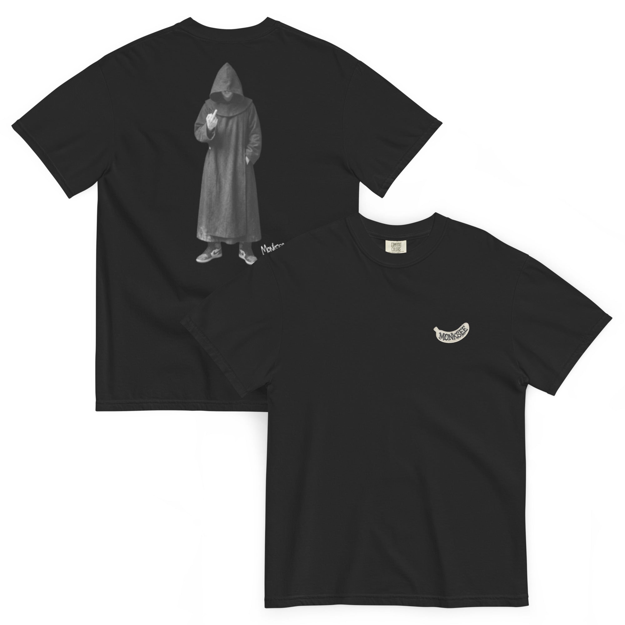 2 black t-shirts laying flat. Back t-shirt has a monk giving the finger. Front t-shirt has a white banana shaped Monksee label