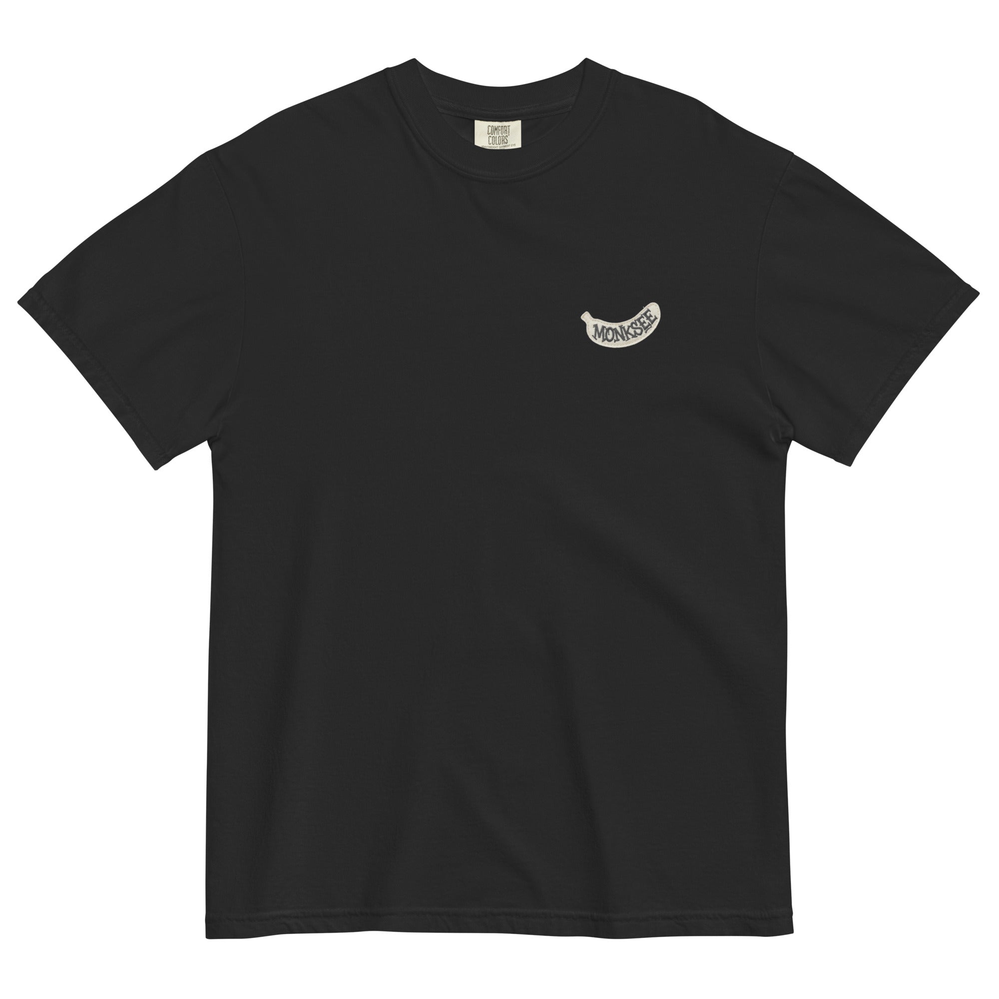 Black t-shirt with a white banana shaped Monksee label on a white background