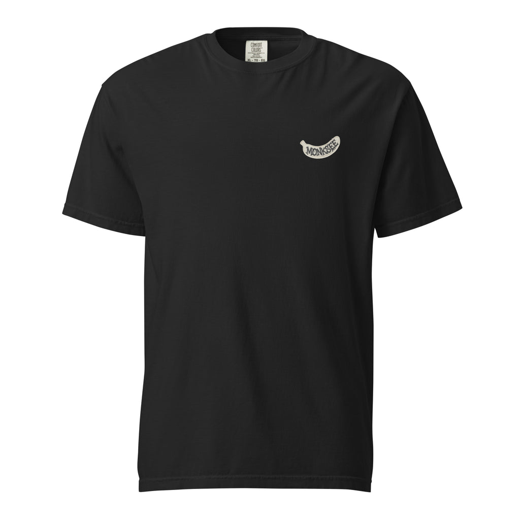 black t-shirt with a white banana shaped Monksee label on the left chest. On a white background