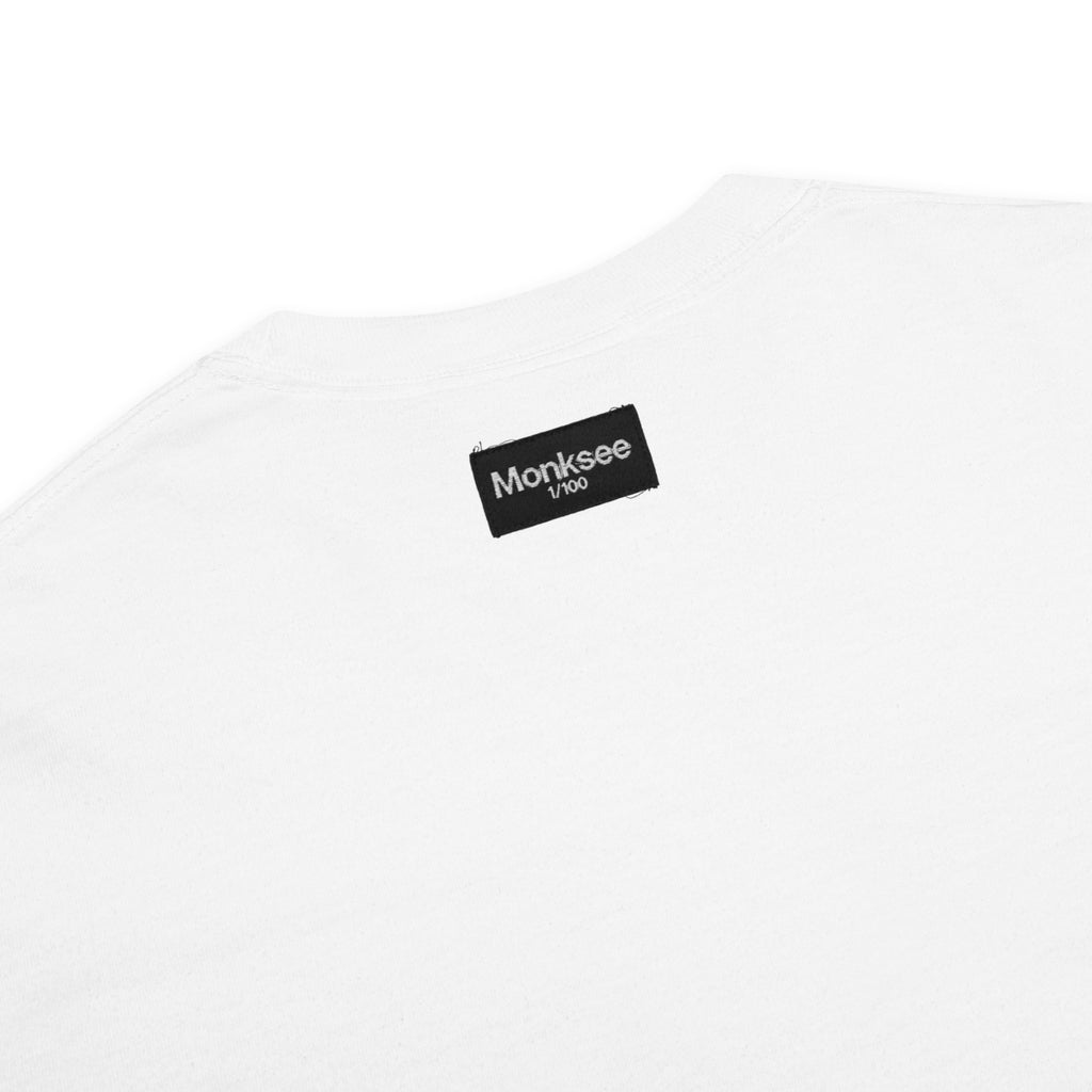 White t-shirt with a black label on a white background