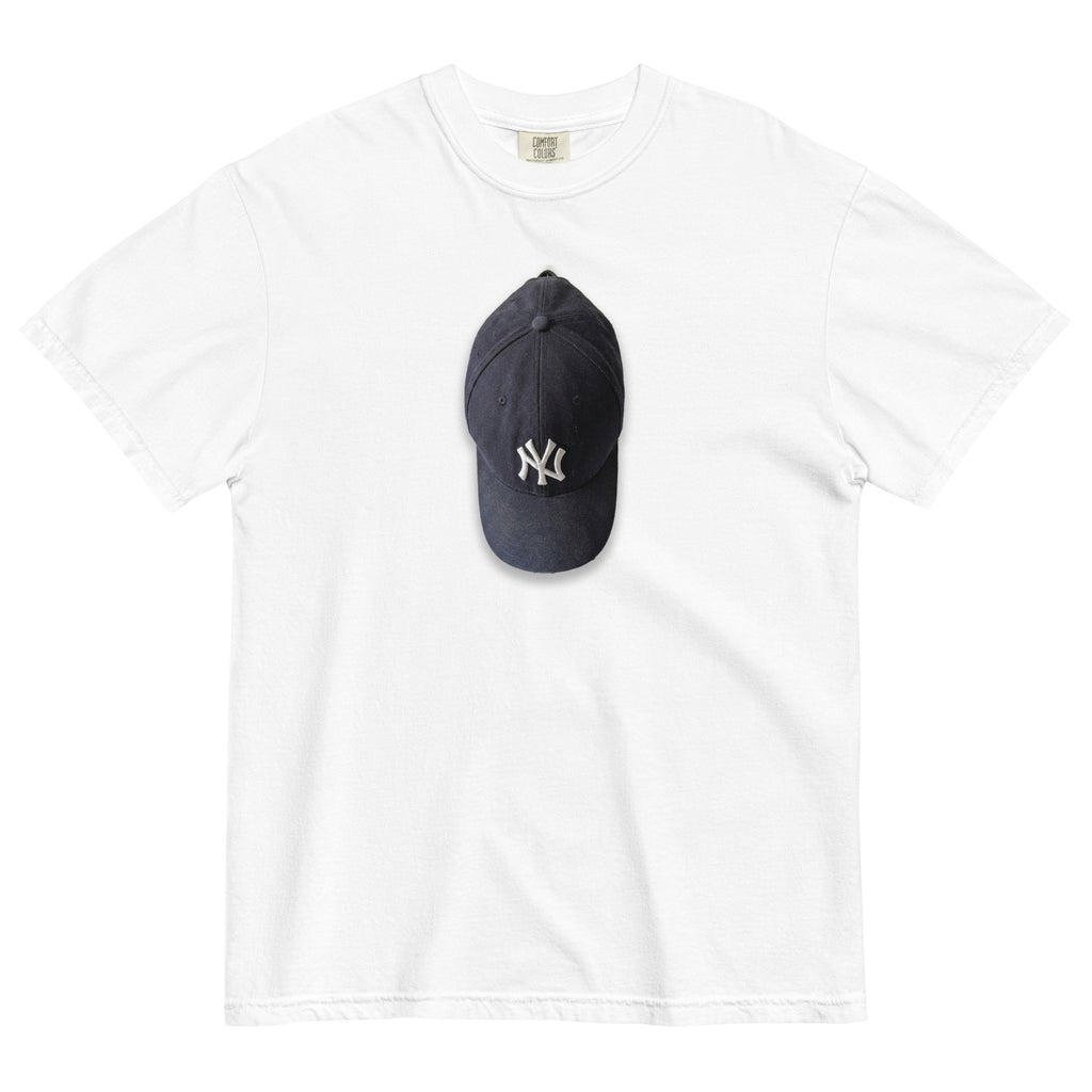 White t-shirt with a NY cap on top, featuring a logo, on a white background