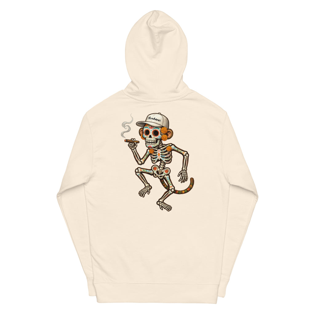 A bone-colored hooded sweatshirt featuring a large graphic print of a dancing skeleton monkey wearing a white baseball cap on the back. The cap has the brand name 'Monksee' printed on it.