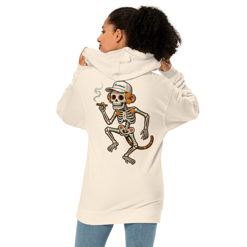 A woman shown from the back wearing a Monksee El Mono Muerto bone colored hoodie, paired with blue jeans against a plain white background.