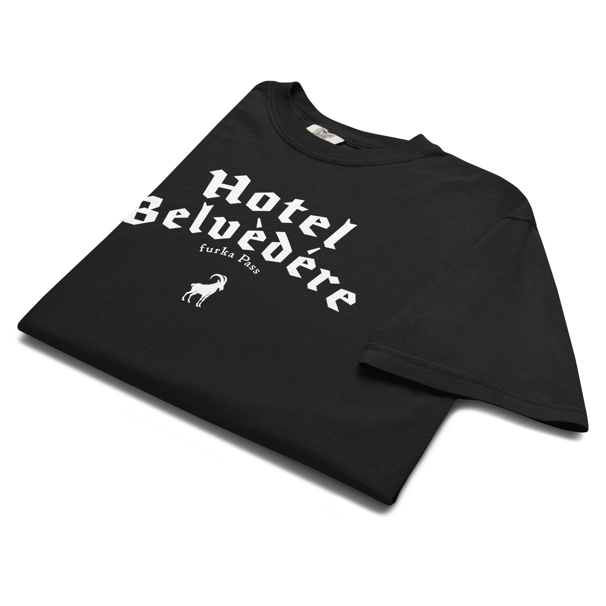 Black folded t-shirt with white Hotel Belvedere graphic on a white background