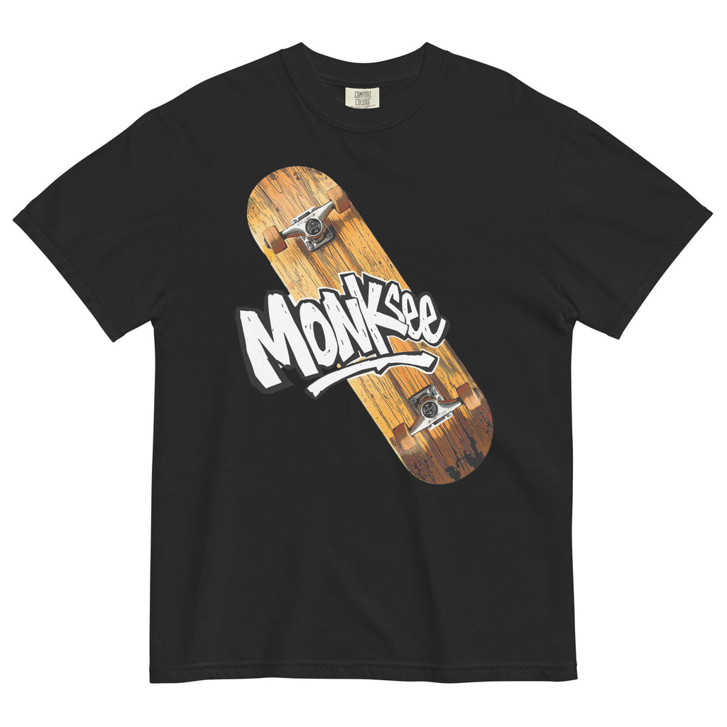 black Monksee kick flip tshirt with skateboard design on the front laying on white background