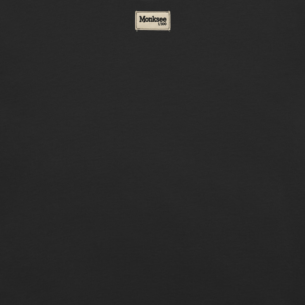 Monksee limited edition label on back of black garment dyed t-shirt