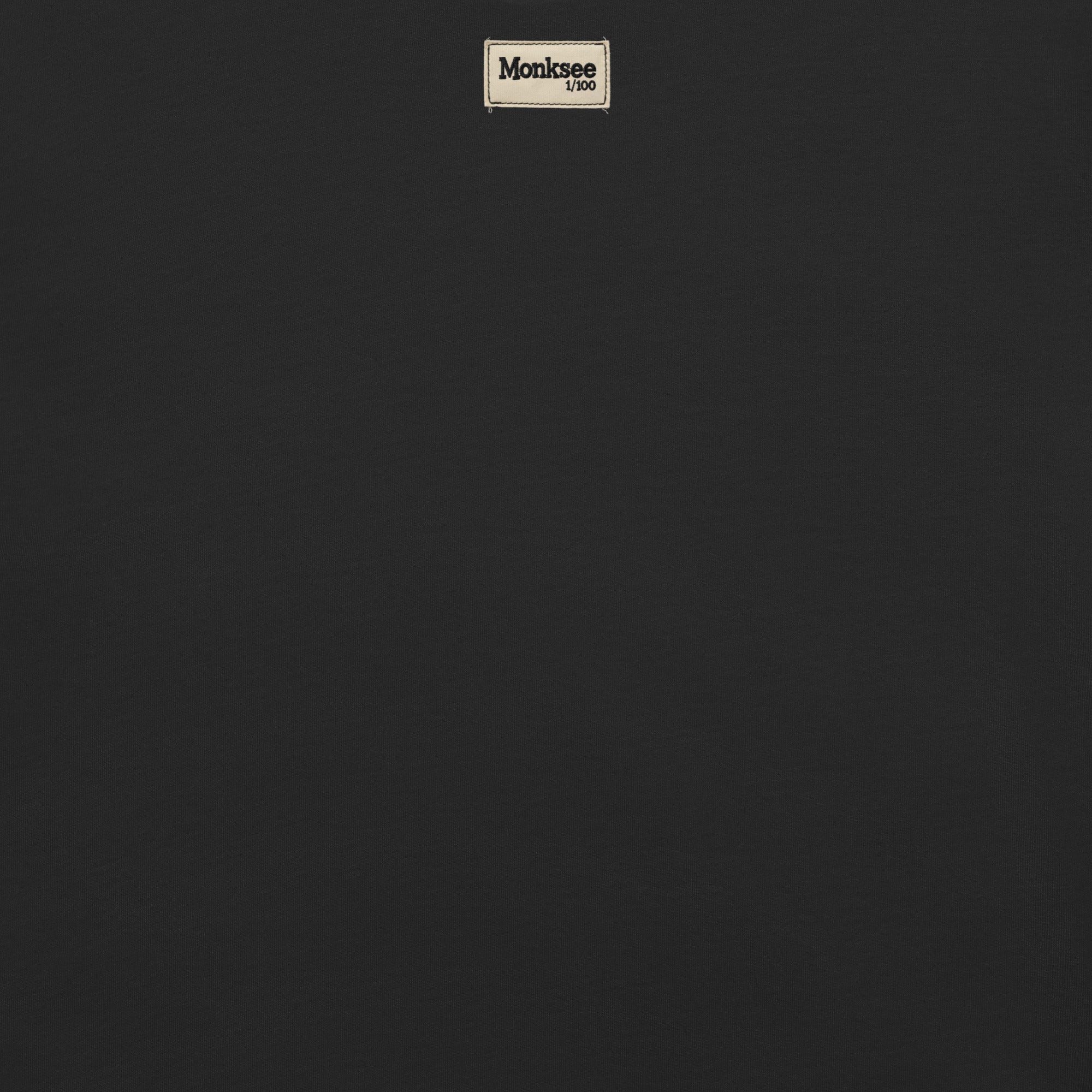 Monksee limited edition label on back of black garment dyed t-shirt