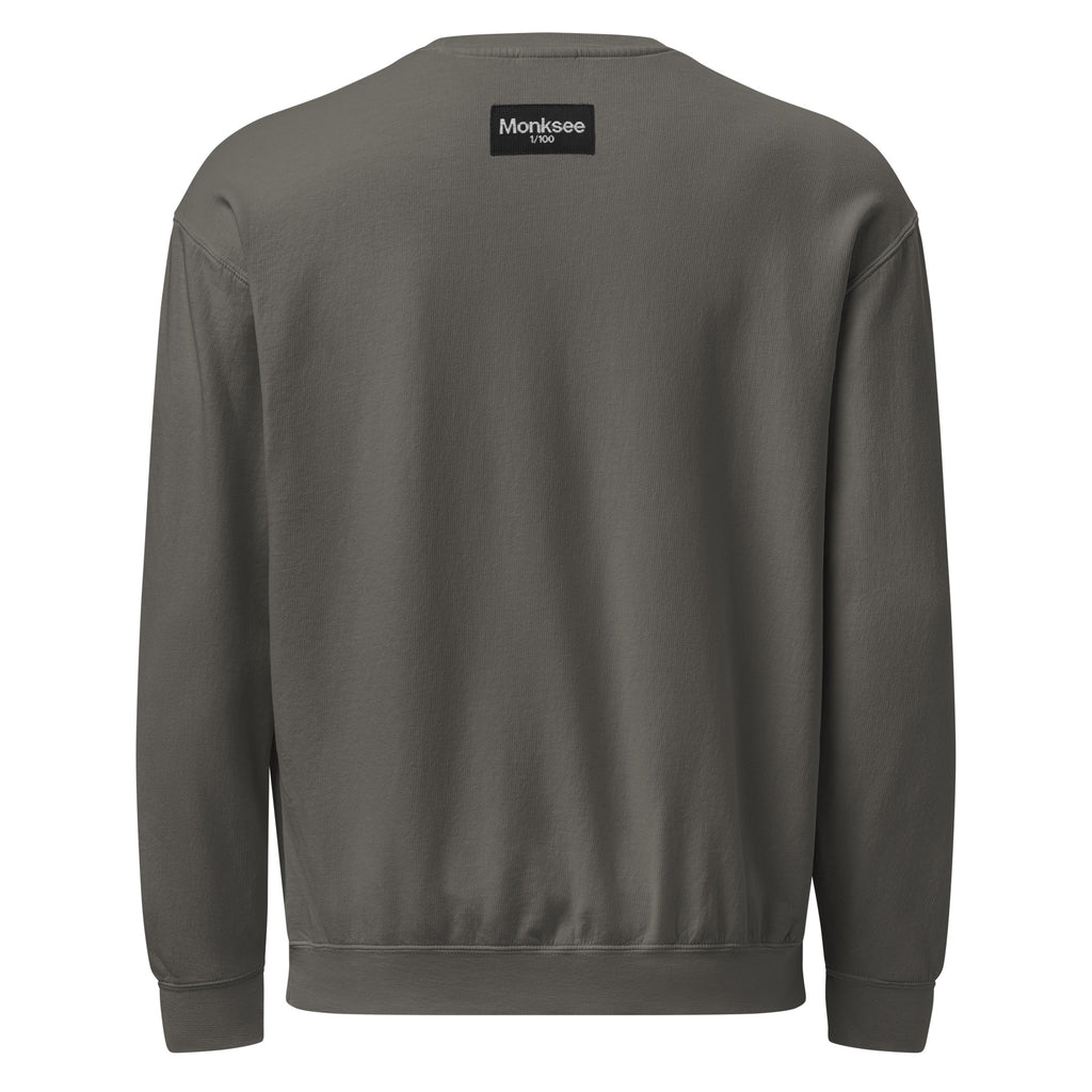 Gray sweatshirt with a Monksee 1/100 label on the back against a white background