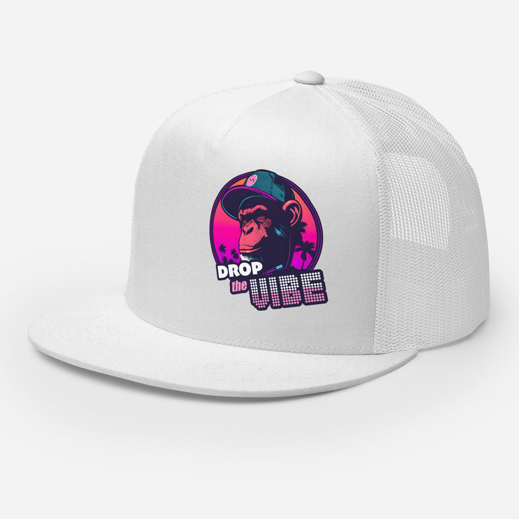 A white Monksee "Drop the Vibe" trucker cap with a mesh back, displayed flat against a white background, showing front and left side. The front features a graphic of a cap-wearing monkey against a sunset with palm trees, with "DROP the VIBE" in bold pink and white text below it. The back has a plain mesh panel with a snapback closure.