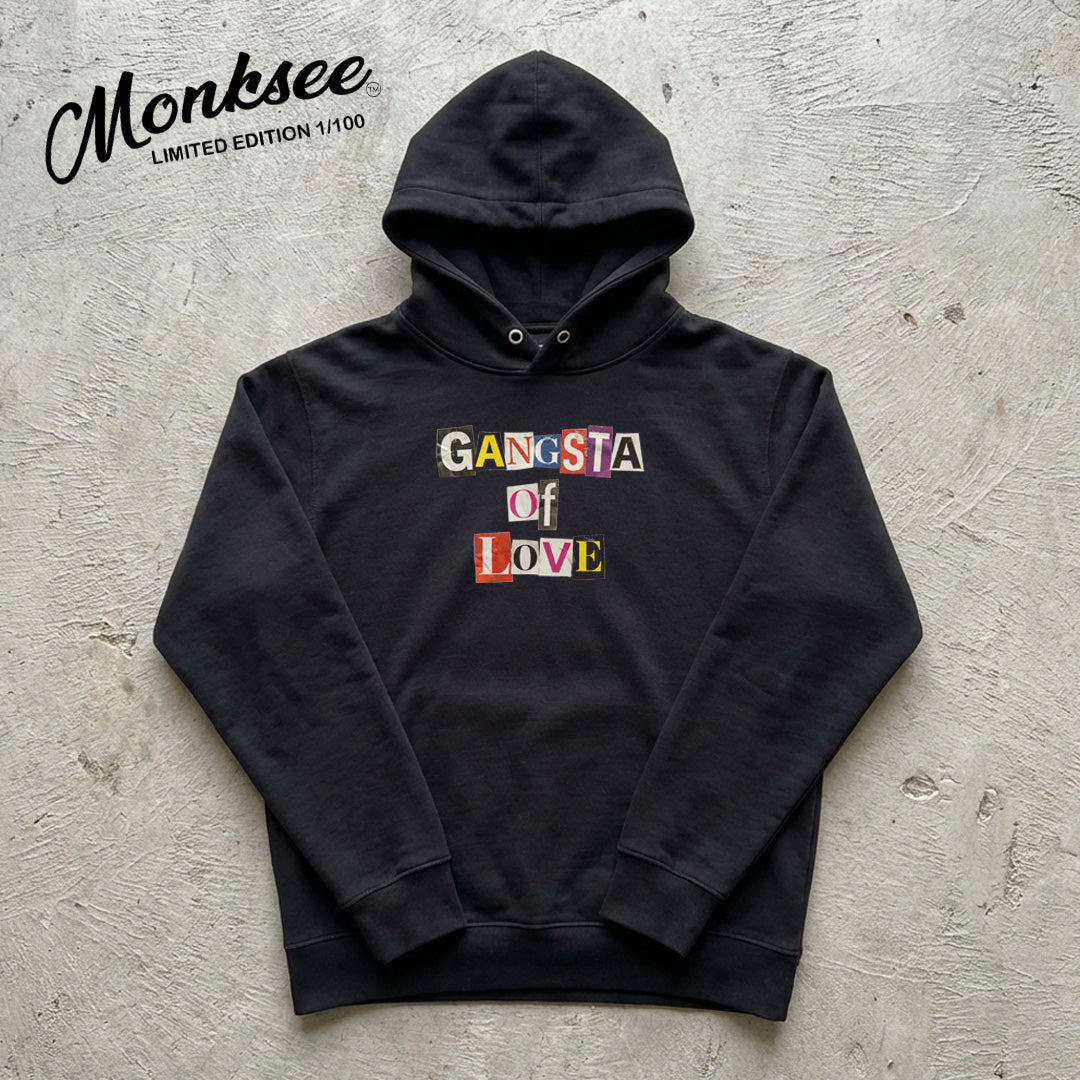 Black hoodie with 'Gangsta of Love' text on a textured gray background, featuring the brand 'Monksee'.