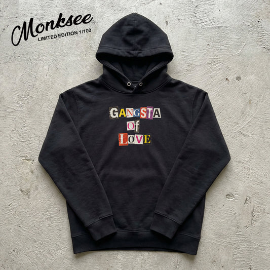 Black hoodie with 'Gangsta of Love' text on a textured gray background, featuring the brand 'Monksee'.