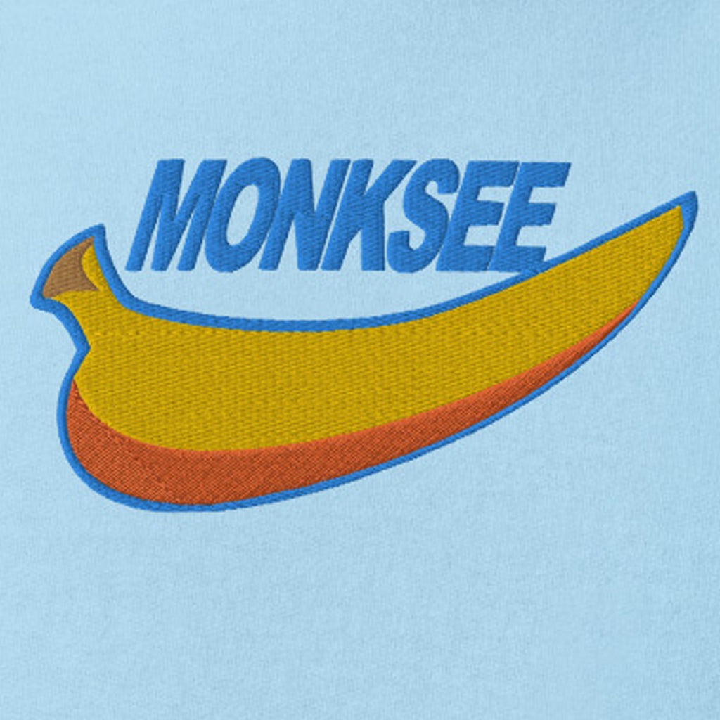 Close up of Monksee just blew it wording and banana on midweight hoodie
