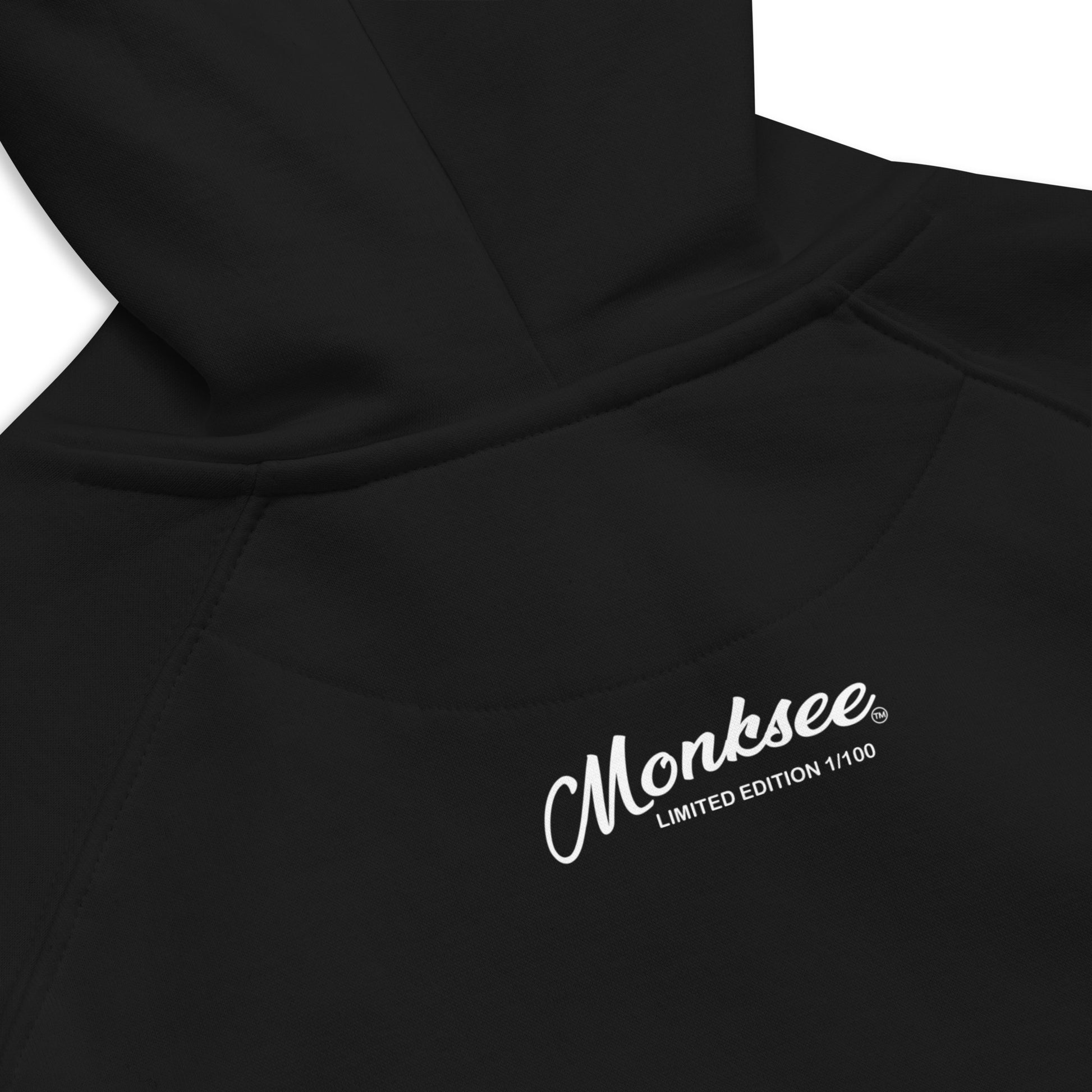 Monksee limited edition label on back of black hoodie