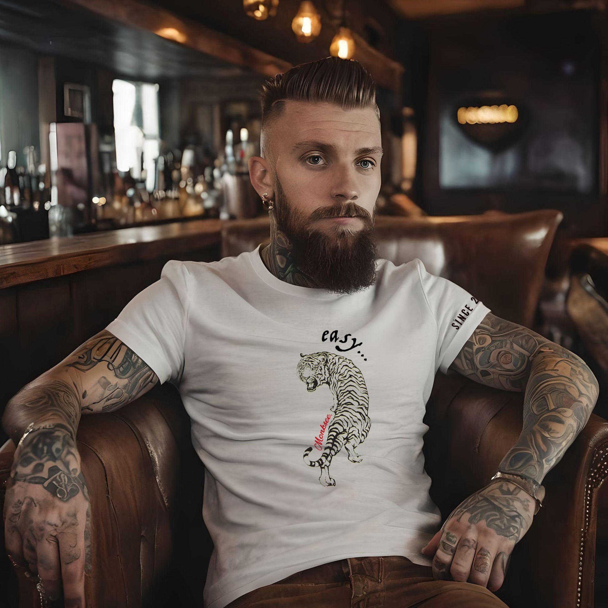 man wearing monksee easy tiger white t-shirt in a bar