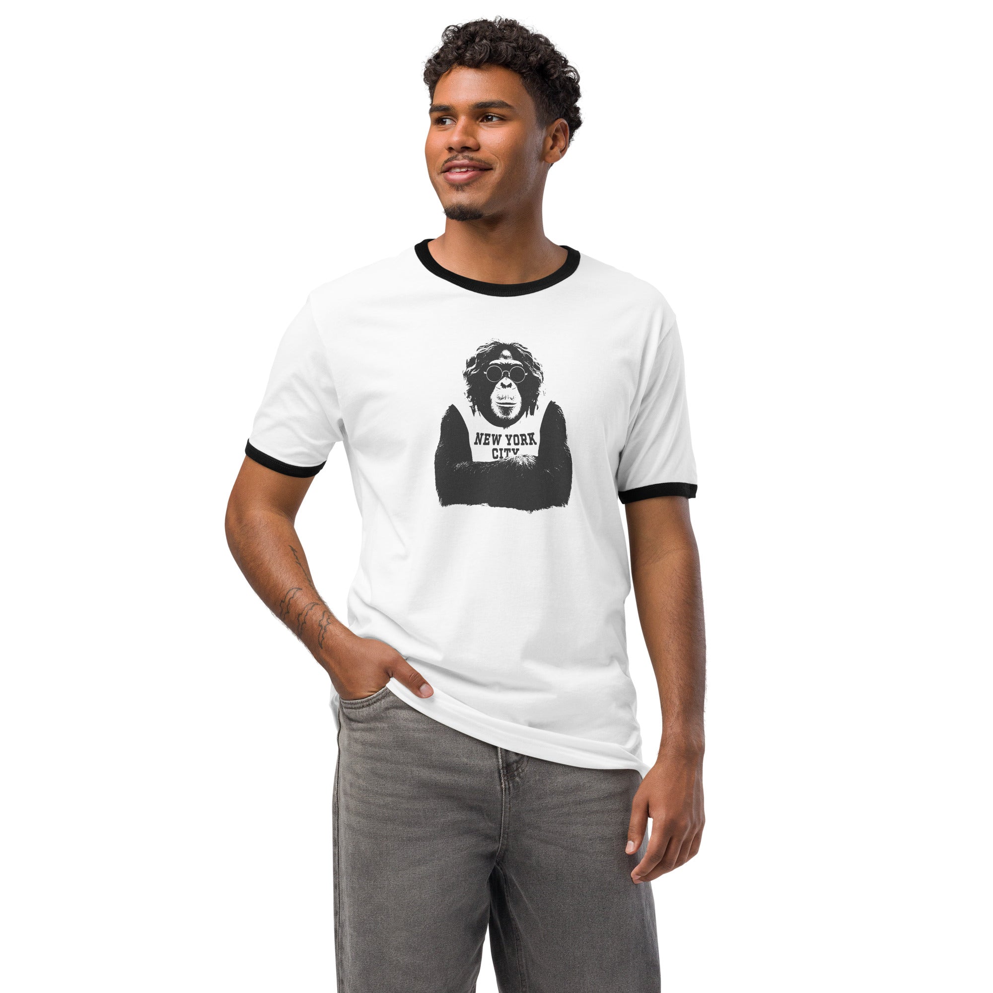 Man wearing a white Monksee t-shirt with a graphic design on a white background