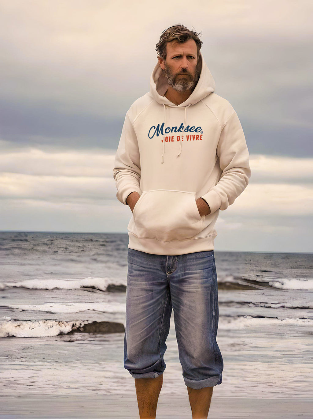man wearing monksee bone midweight hoodie on the beach
