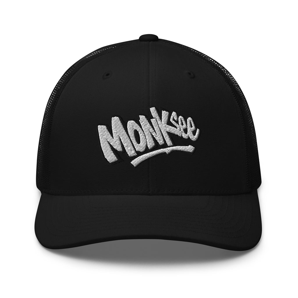 black monksee kick flip retro trucker cap with embroidered logo on a white background