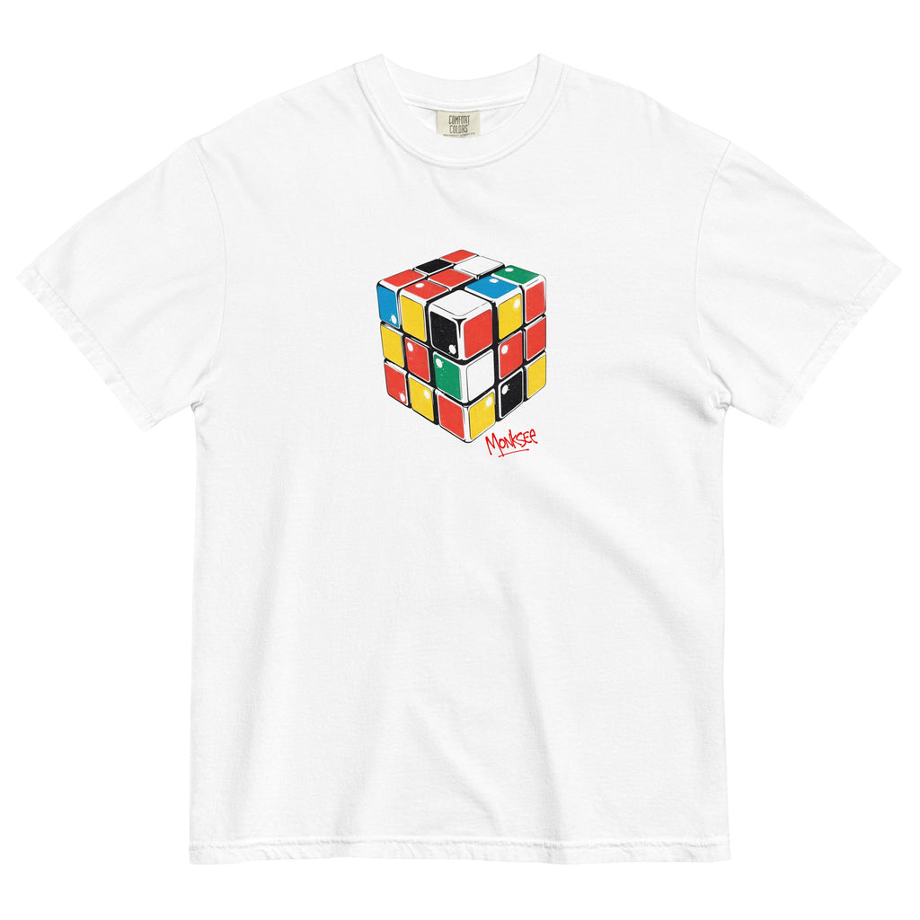 front view of a black Monksee "Rad Rubiks" t-shirt displayed flat against a white background. A small pink Monksee logo is on the back neck, with the word "monksee" in pink printed below it