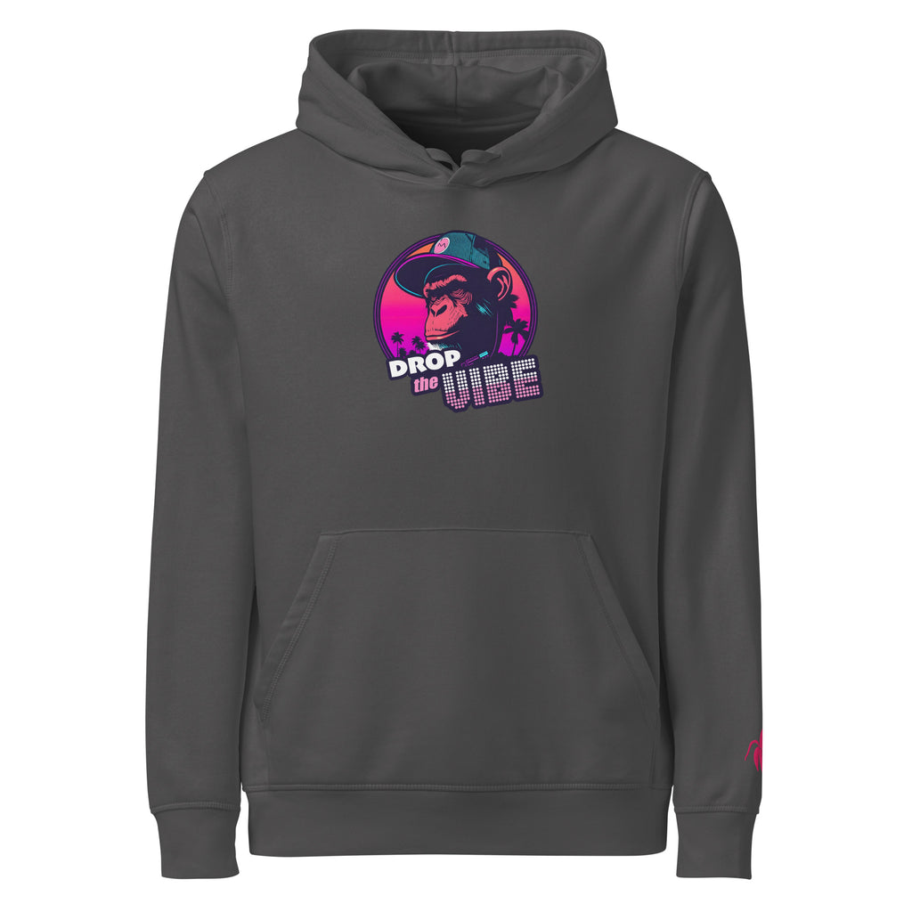 A anthracite Monksee "Drop the Vibe" hoodie displayed flat against a white background. It features a neon graphic of a cap-wearing monkey against a sunset with palm trees, with "DROP the VIBE" in bold pink and white text. A small pink Monksee banana logo is on the left sleeve.