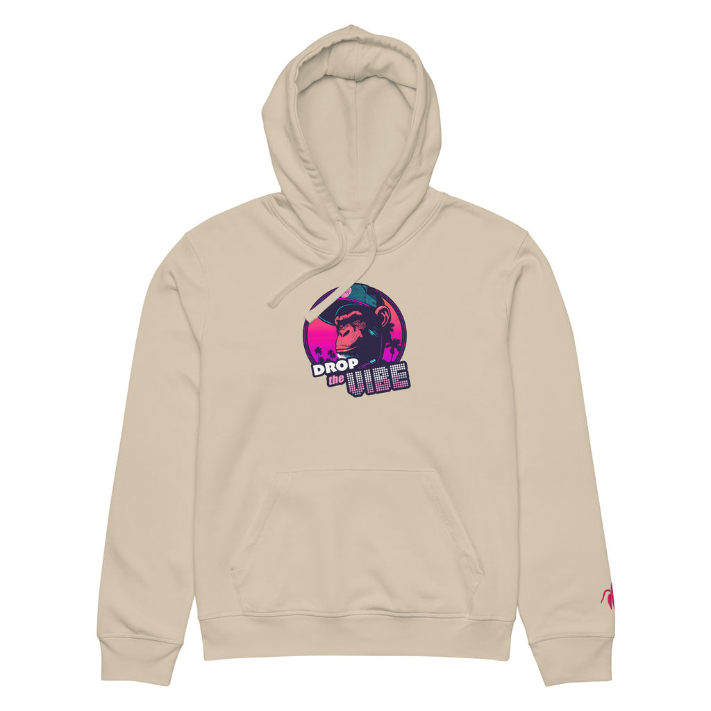 A desert Monksee "Drop the Vibe" hoodie up displayed flat against a white background. It features a neon graphic of a cap-wearing monkey against a sunset with palm trees, with "DROP the VIBE" in bold pink and white text. A small pink embroidered Monksee banana logo is on the left sleeve