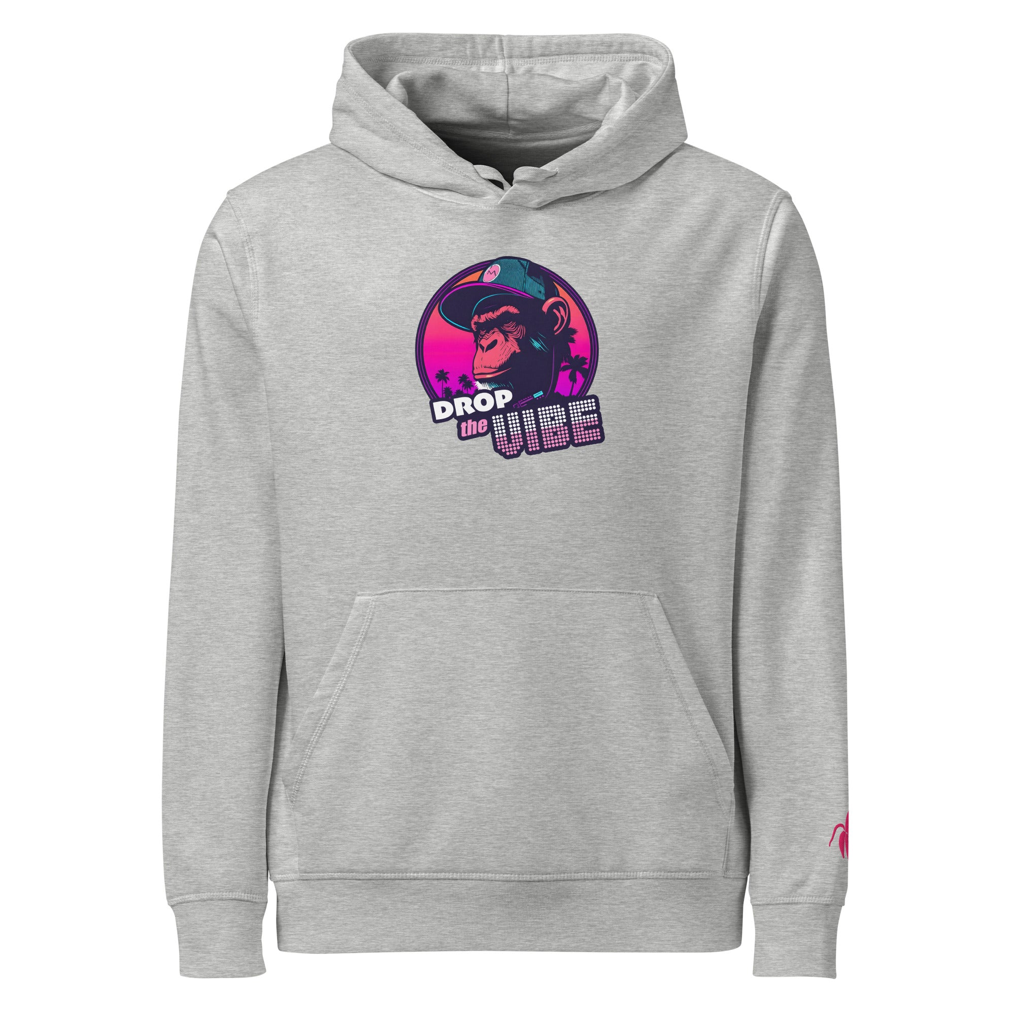 A grey Monksee "Drop the Vibe" hoodie displayed flat against a white background. It features a neon graphic of a cap-wearing monkey against a sunset with palm trees, with "DROP the VIBE" in bold pink and white text. A small pink Monksee banana logo is on the left sleeve.