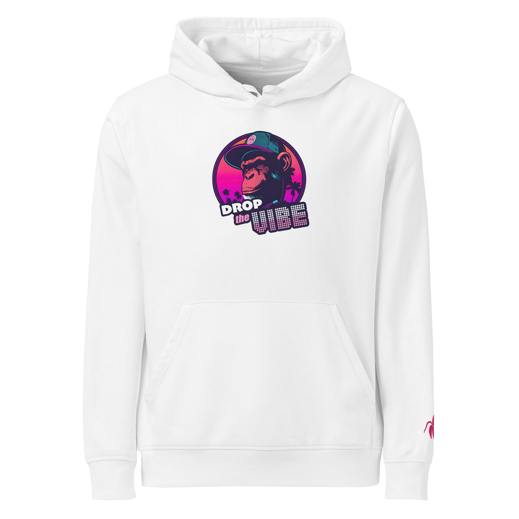 A white Monksee "Drop the Vibe" hoodie displayed flat against a white background. It features a neon graphic of a cap-wearing monkey against a sunset with palm trees, with "DROP the VIBE" in bold pink and white text. A small pink Monksee banana logo is on the left sleeve.