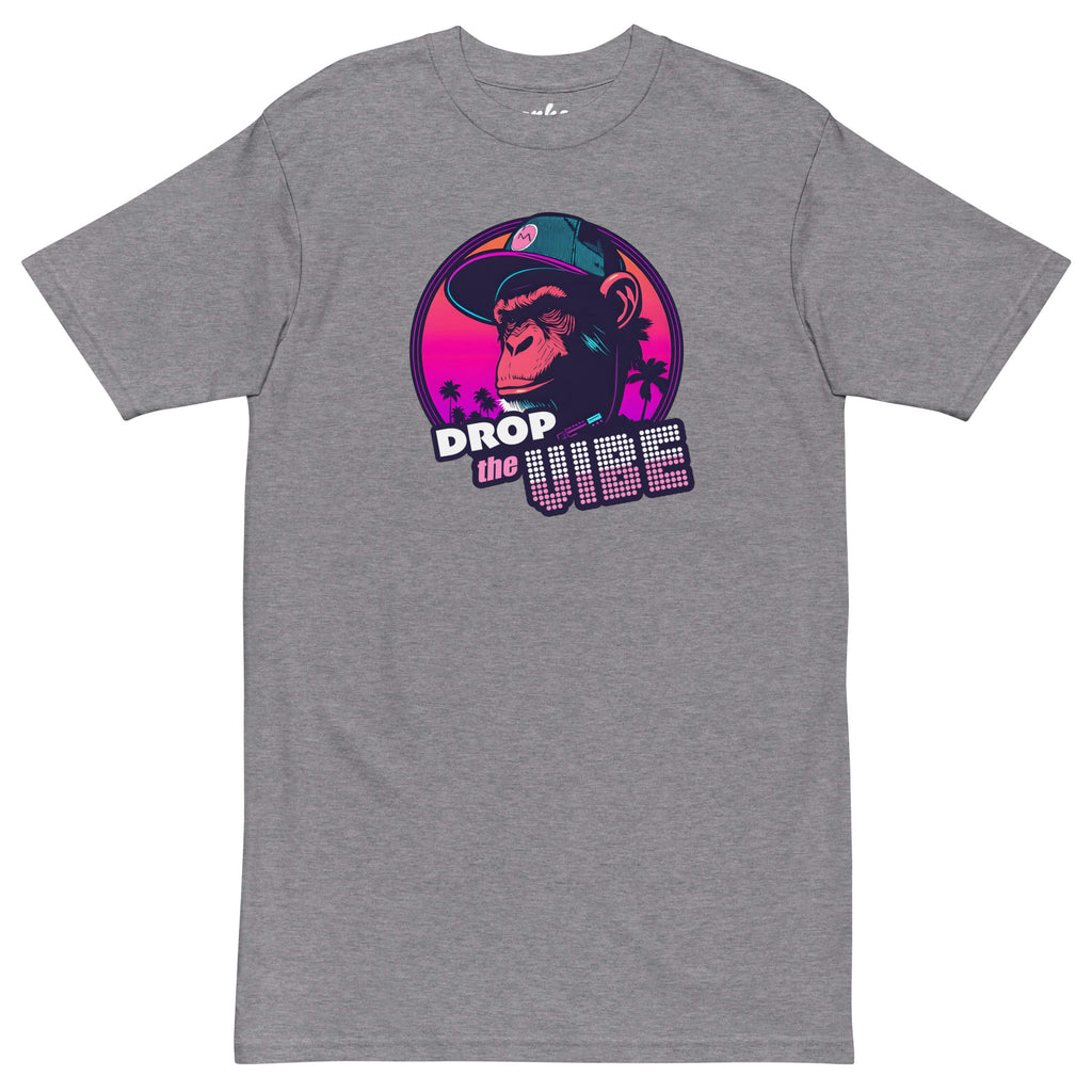 athletic grey Monksee "Drop the Vibe" t-shirt displayed completely flat against a white background. It features a neon graphic of a cap-wearing monkey against a sunset with palm trees, with "DROP the VIBE" in bold pink and white text.
