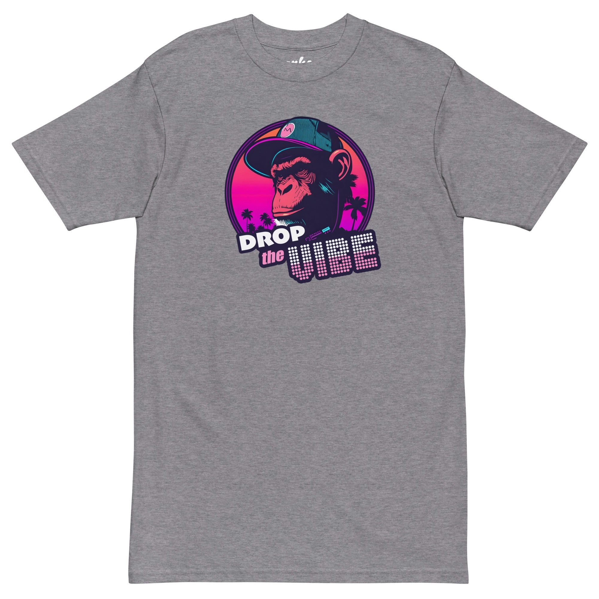 athletic grey Monksee "Drop the Vibe" t-shirt displayed completely flat against a white background. It features a neon graphic of a cap-wearing monkey against a sunset with palm trees, with "DROP the VIBE" in bold pink and white text.