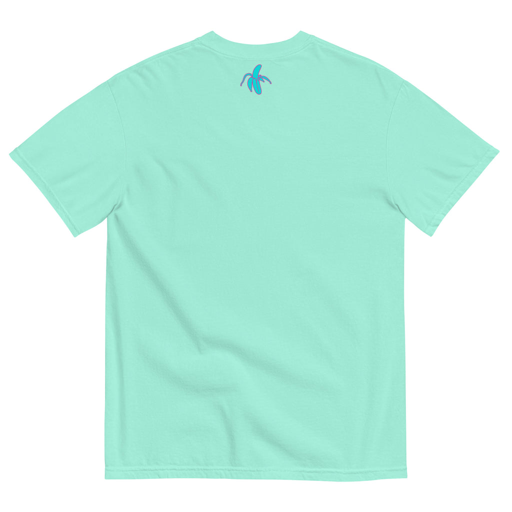 monksee kickin it chalky mint tee laying flat on a white background. Features the monksee banana logo on the back label in teal and pink