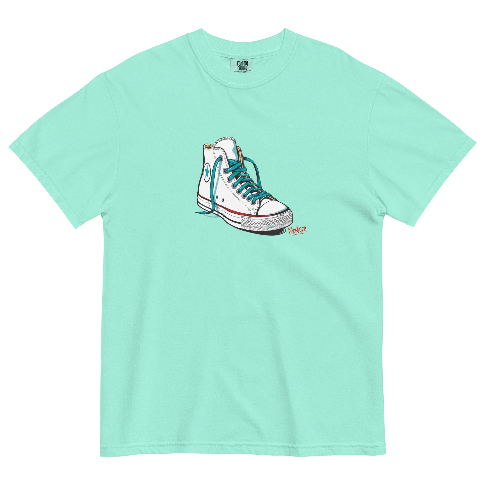 chalky mint garment dyed tshirt laying flat on white background. tshirt features design of a vintage chuck Taylor Allstars with monksee tag underneath in red