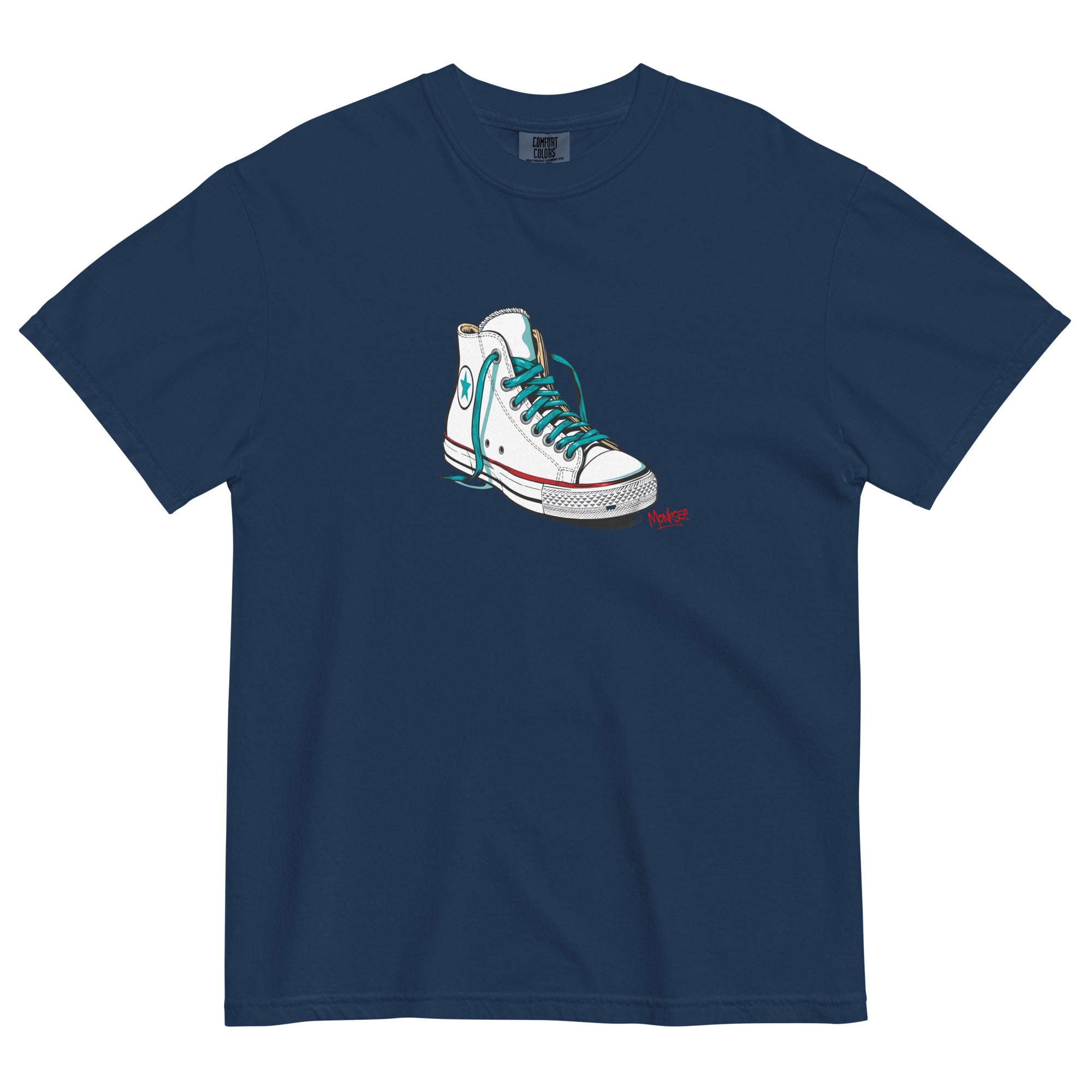 navy garment dyed tshirt laying flat on white background. tshirt features design of a vintage chuck Taylor Allstars with monksee tag underneath in red