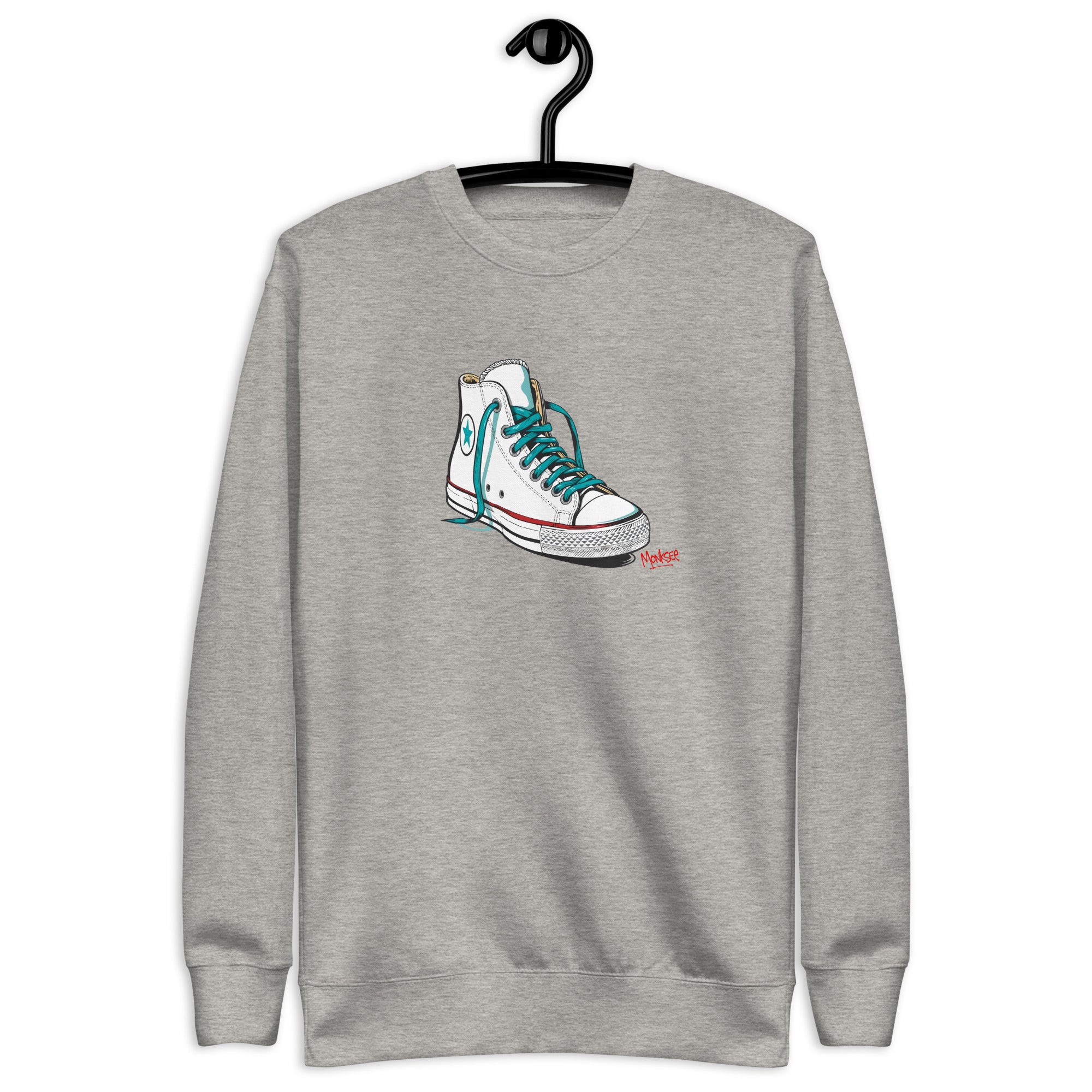 grey monksee sweatshirt featuring kickin it chuck Taylor all-stars design on front. hanging on a hanger on a white background