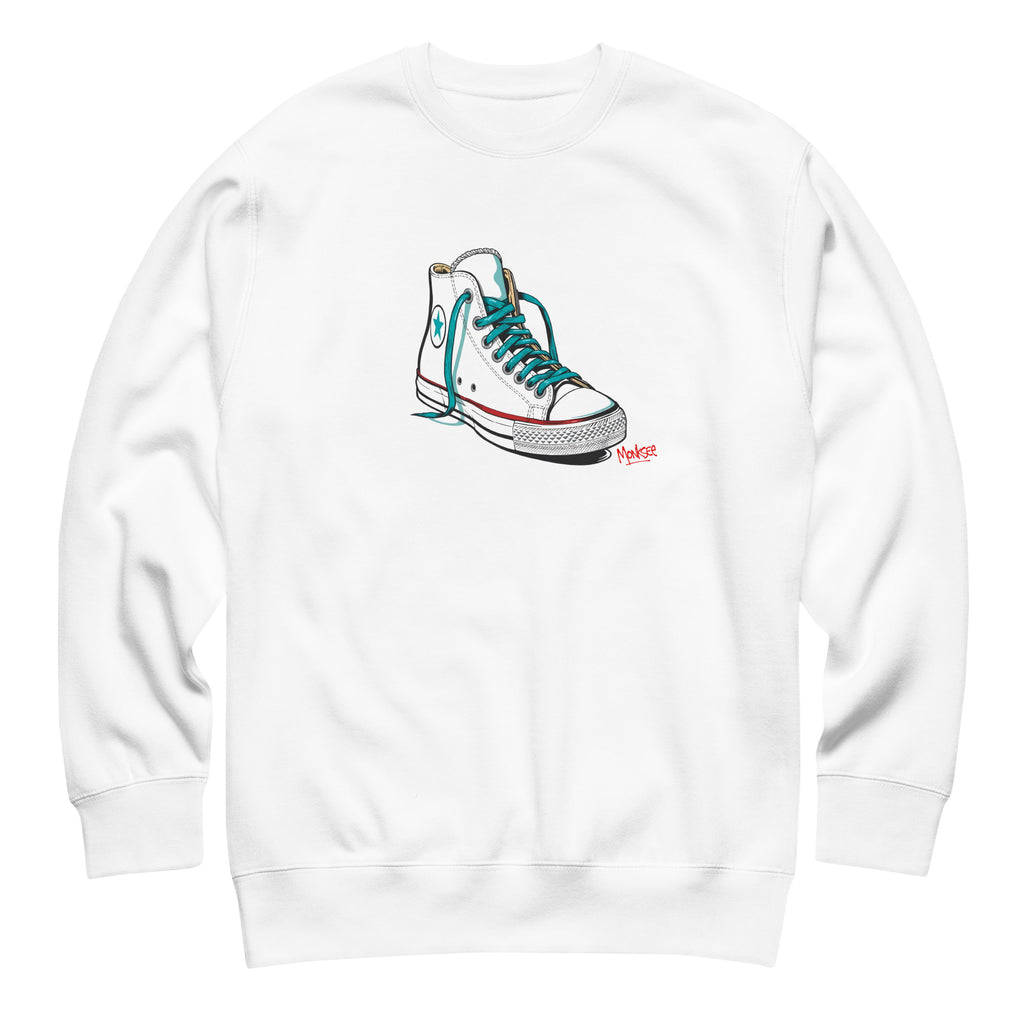 A white Monksee "Kickin It!" sweatshirt front displayed against a white background. The front features a white sneaker graphic with blue laces.